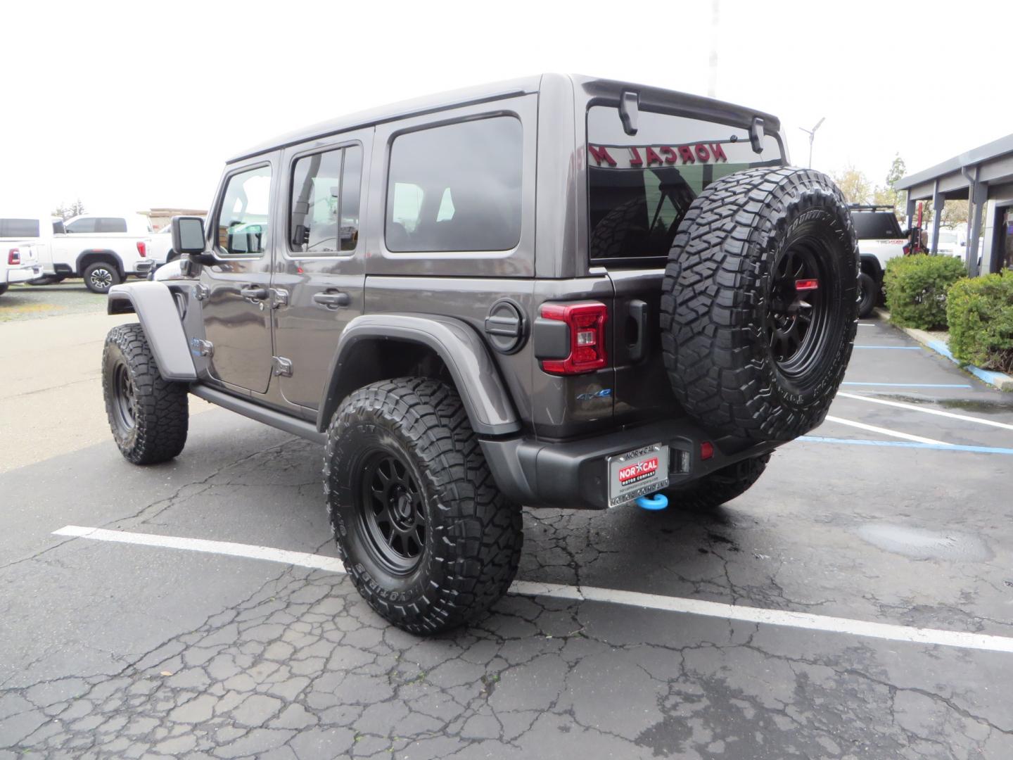 2021 CHARCOAL /BLACK Jeep Wrangler Unlimited Rubicon 4XE 4d SUV 4wd (1C4JJXR60MW) with an 2.0L L4 DOHC 16V TURBO engine, automatic transmission, located at 2630 Grass Valley Highway, Auburn, CA, 95603, (530) 508-5100, 38.937893, -121.095482 - 4XE Rubicon sitting on a Zone offroad suspension system, Fox shocks, 37" Toyo RT trail tires, 17" Method Race wheels, Teraflex Hd tire carrier, and Flat tow ready. - Photo#6